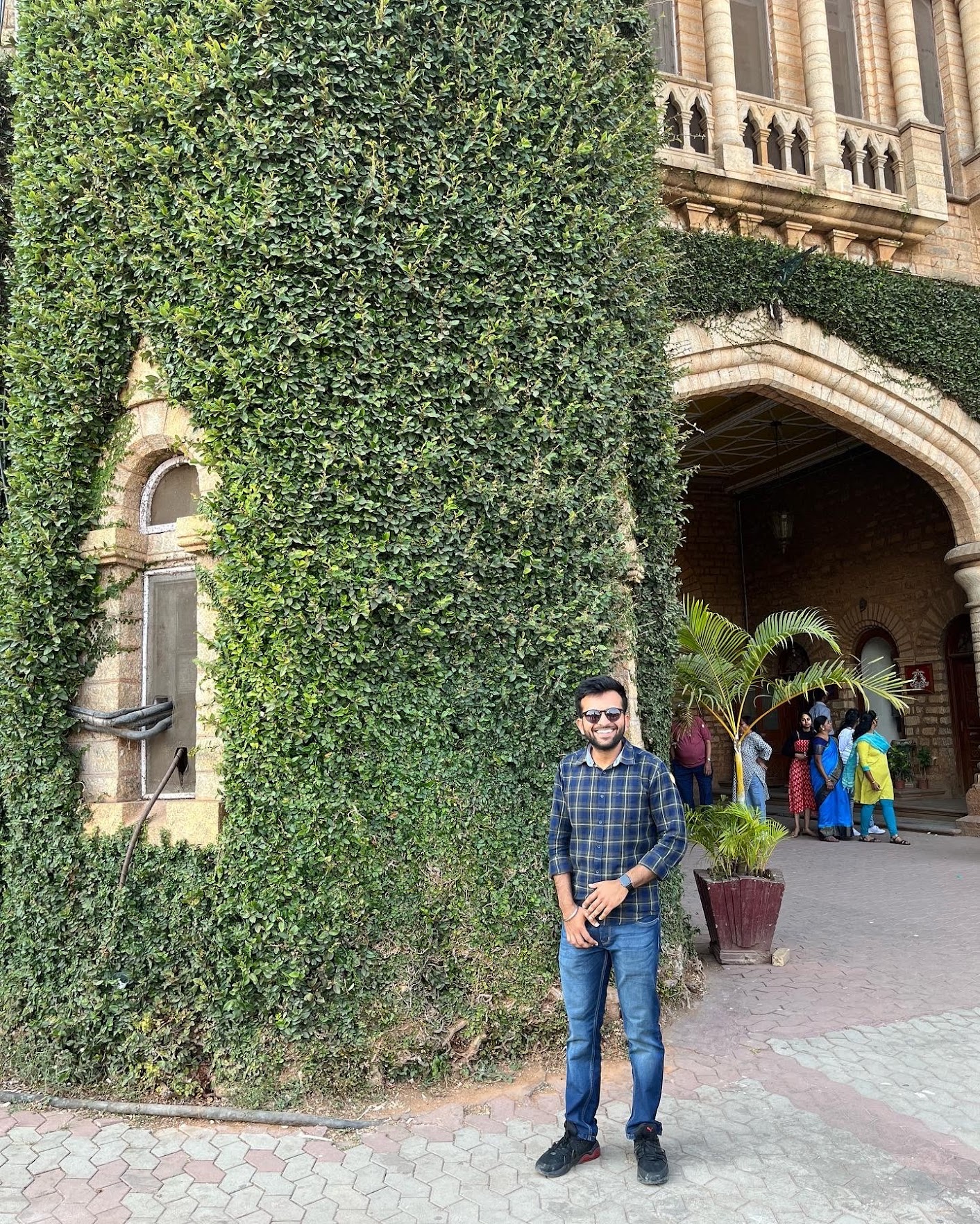 Sanyam Aggarwal standing in front of a building
